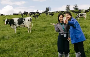 Two visitors to Ireland take a selfie in a field full of diary cows as part of the visit by buyers, media and foodservice customers from Vietnam, China, Singapore and Japan to Ireland.