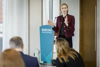 Woman presenting at a podium