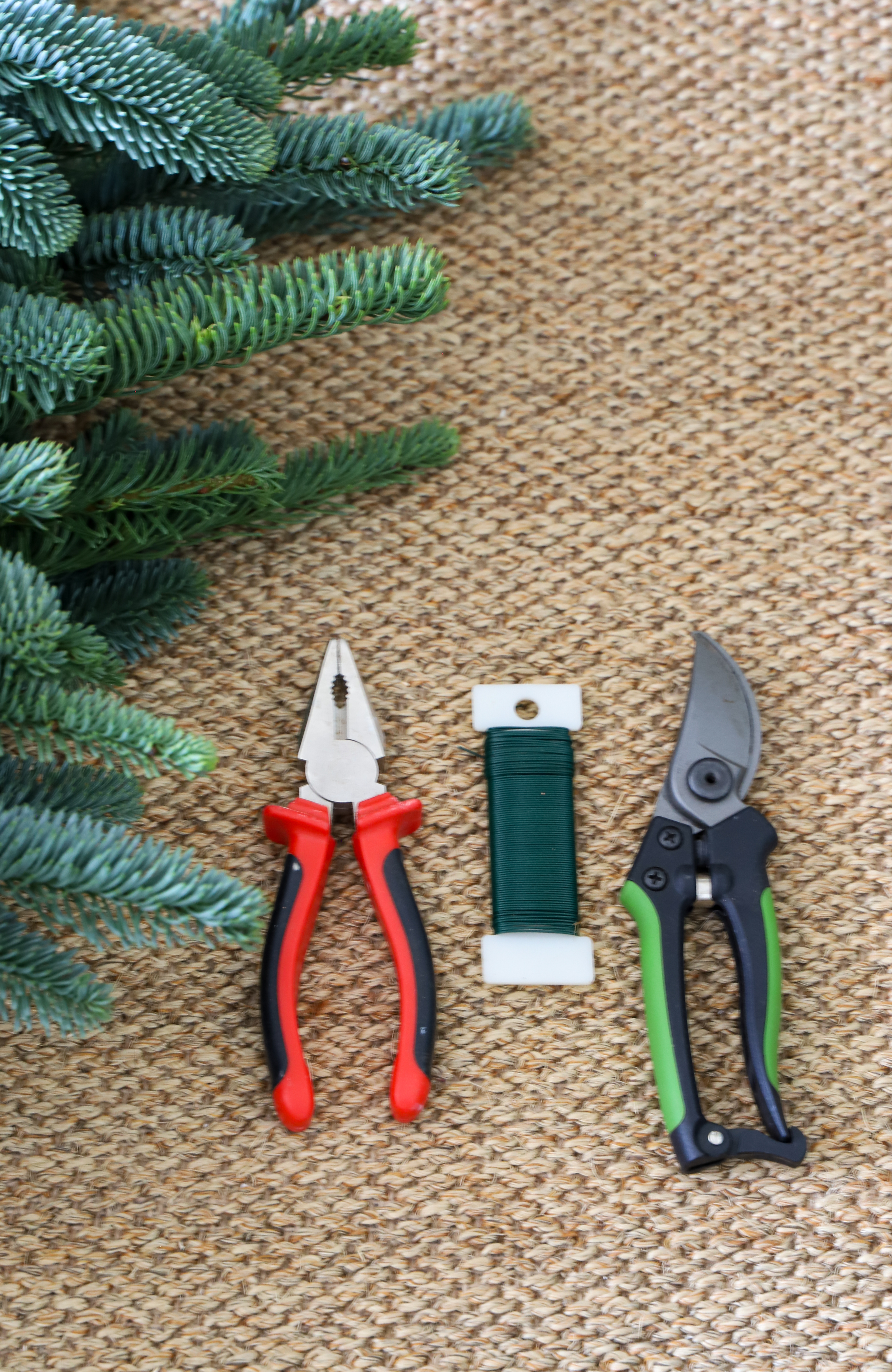 tools beside green foliage