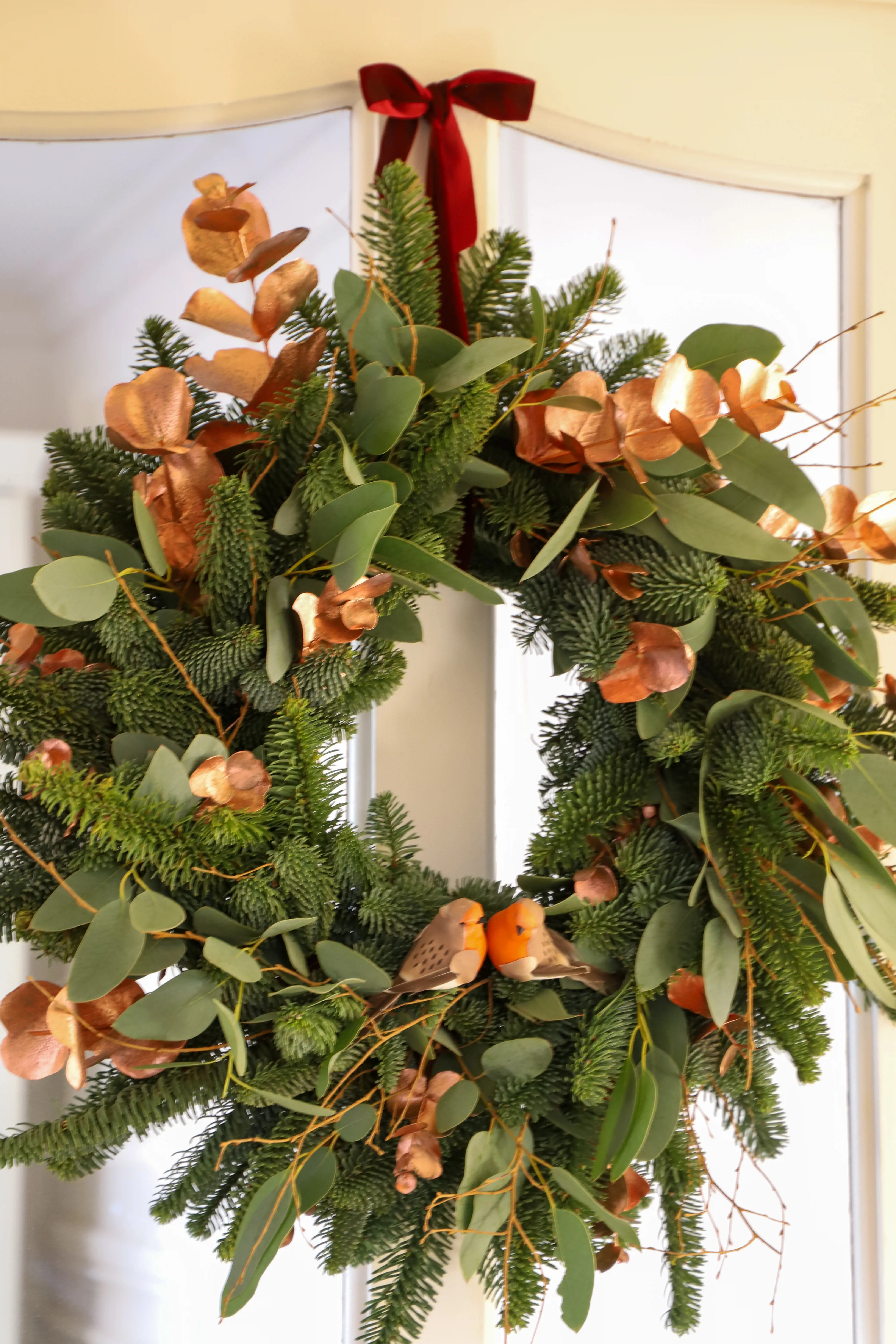 Finished Christmas wreath with ribbon and ornaments