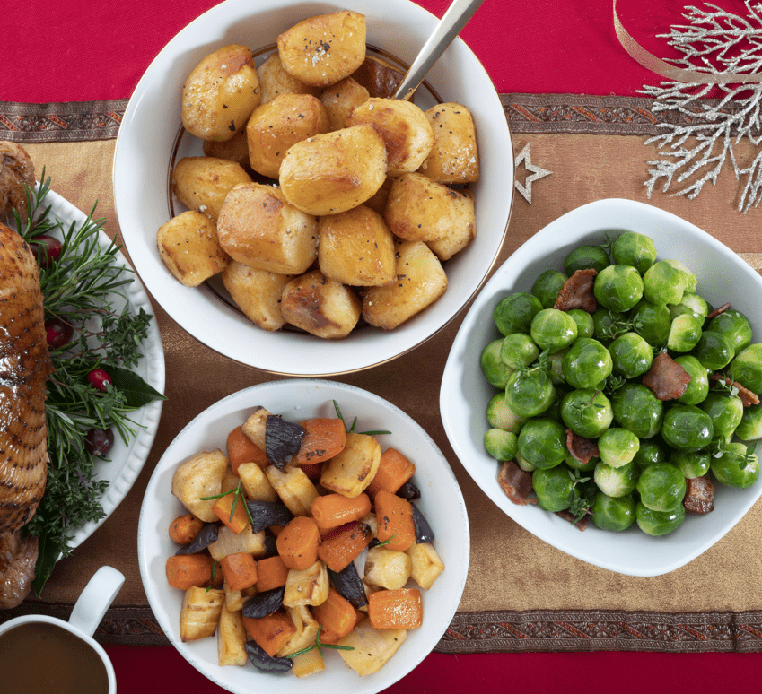 Bowls with food on top of a festive tablecloth