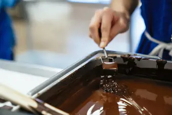 Chocolate being stirred in tin